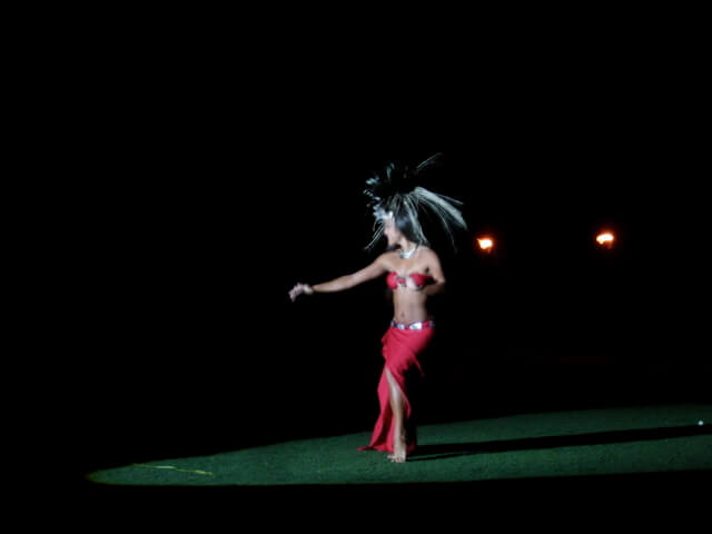 Hulda dancer with feathers in her hair at the Old Lahaina Luau in Maui, Hawaii.
