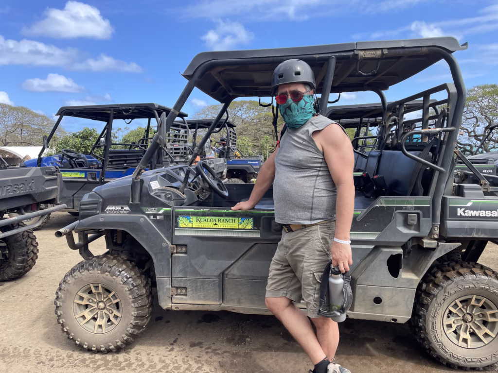 Man standing with Kualoa Ranch ATV