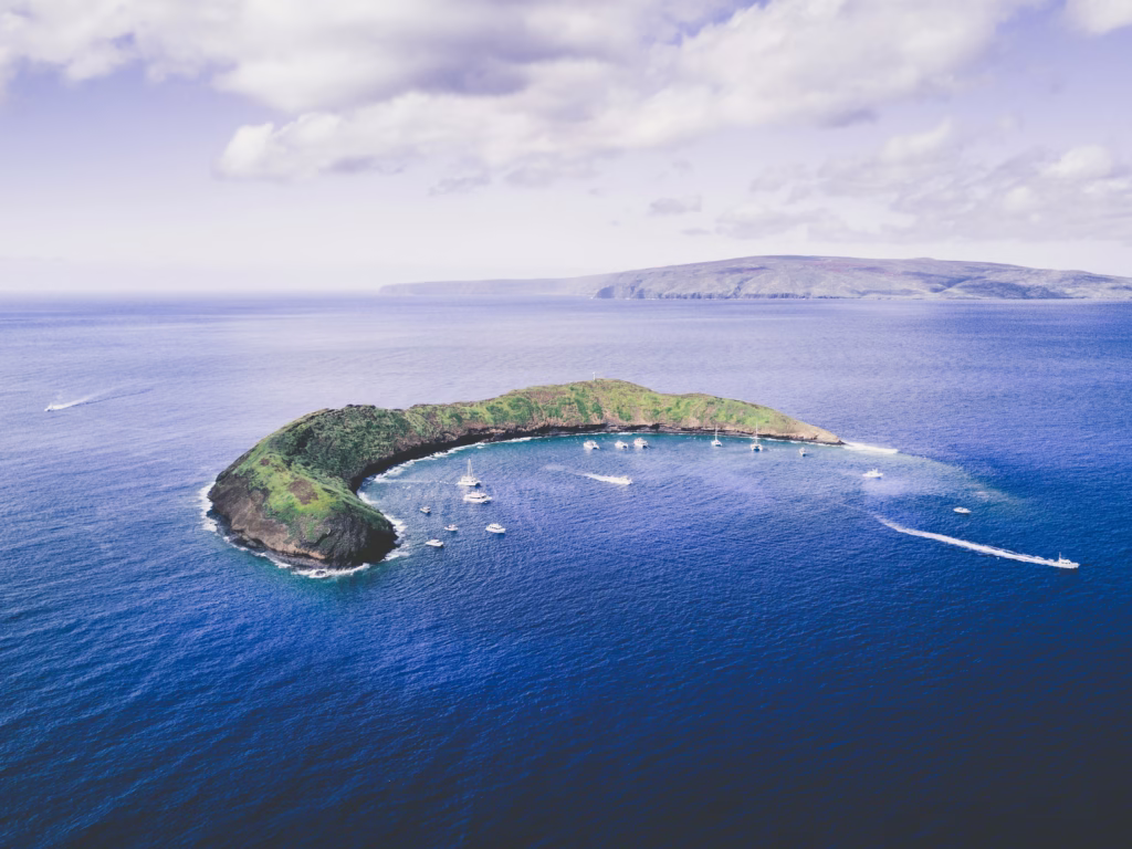 Molokini Crater with boats in the shallow waters