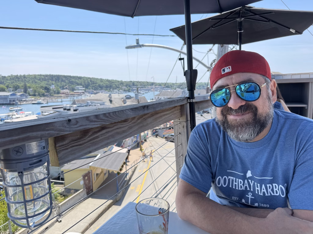 Sitting at the third floor open air deck at Boathouse Bistro Boothbay Harbor
